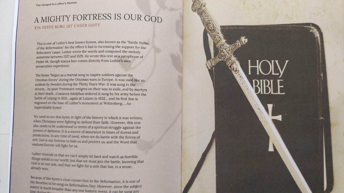 A book open to the pages of a book

AI-generated content may be incorrect.